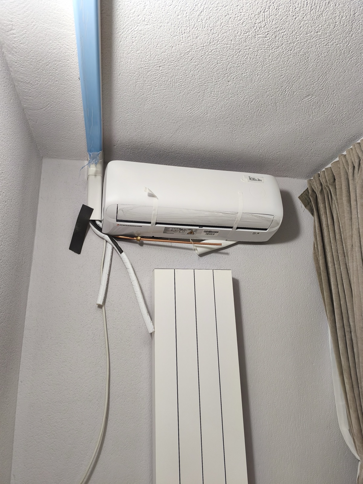 Wall-mounted indoor AC unit installation