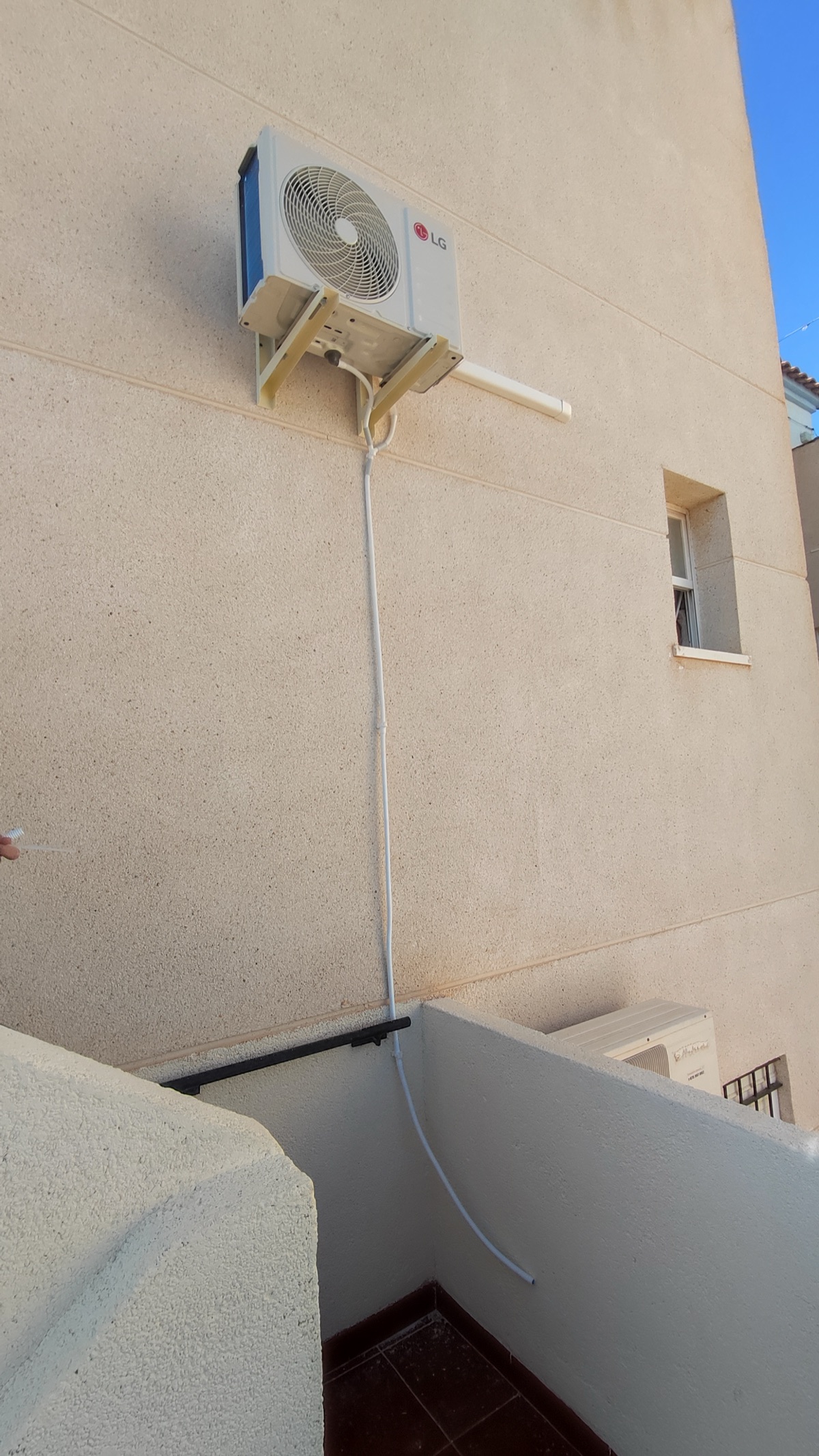 LG outdoor unit on building facade