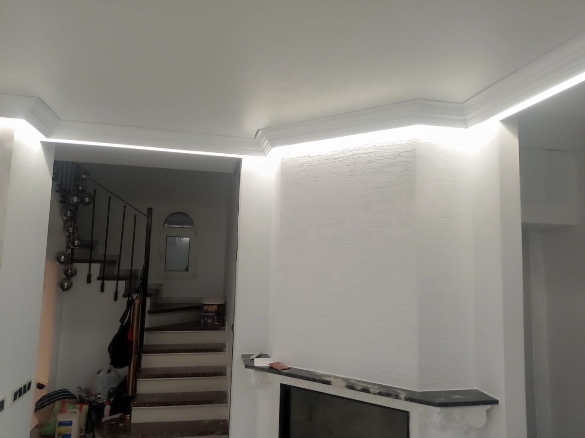 Perimeter ceiling LED lighting in living room